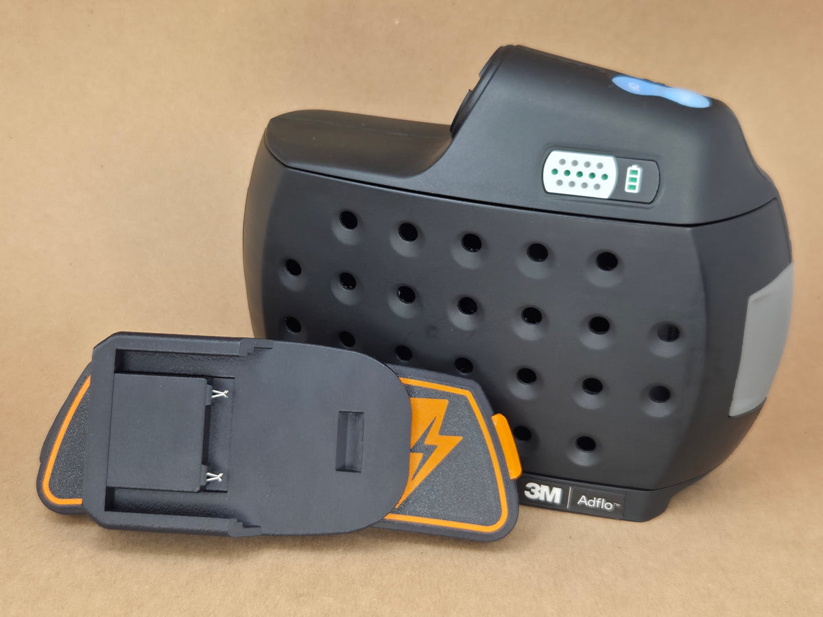 RIDGID AEG 18V Adflo adapter - adapter detached in front of the Adflo blower - scale shot